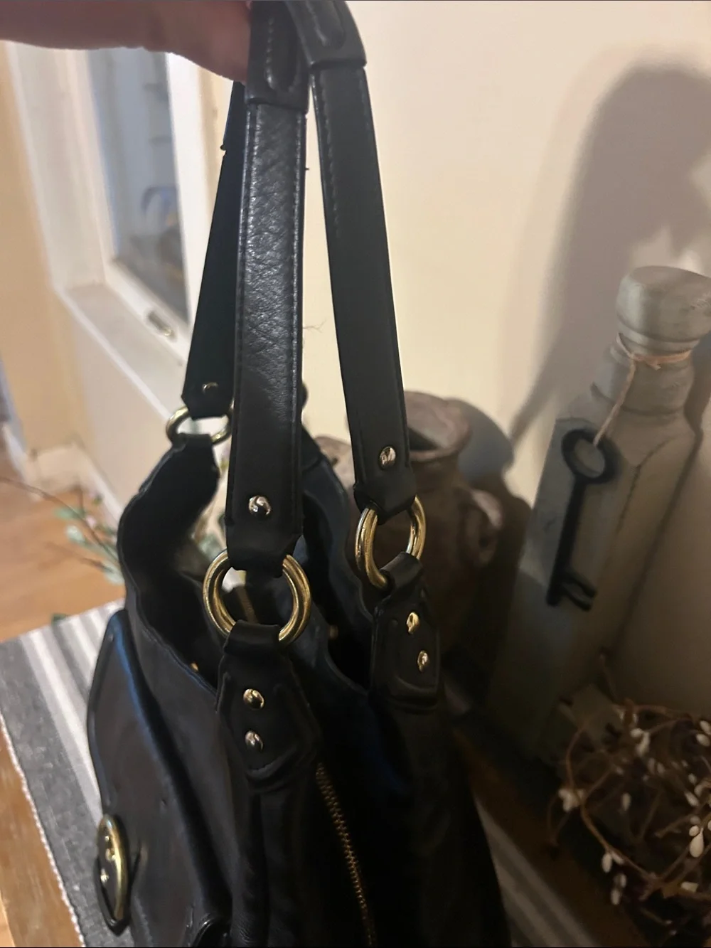 Coach Black Leather Shoulder Bag with Front Buckle Pocket and Gold Hardware